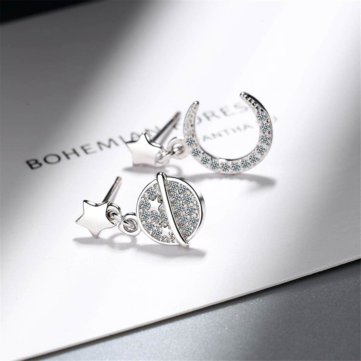 Cubic Zirconia & Silvertone Moon & Planet Drop Earrings