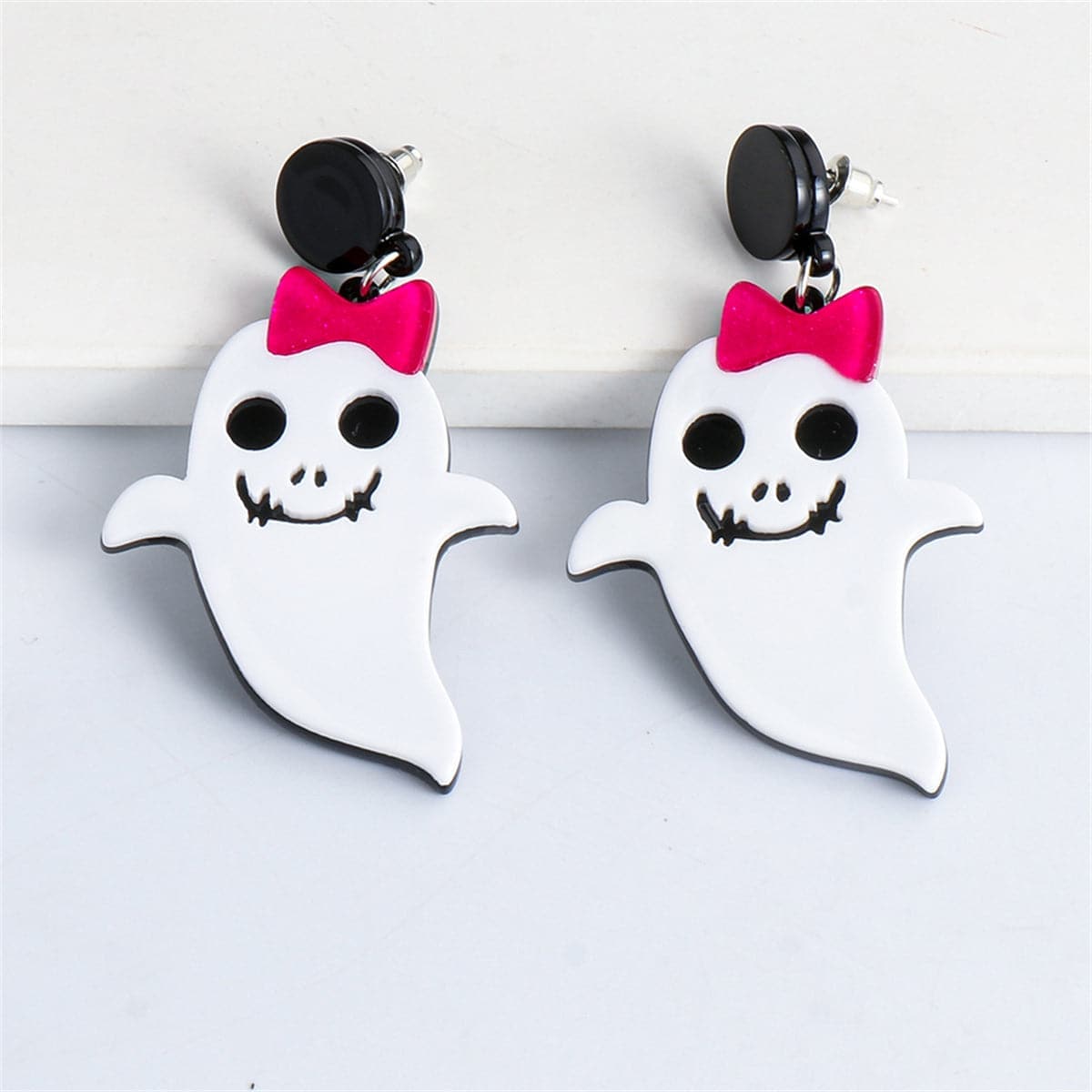 White Acrylic & Silvertone Bow Ghost Drop Earrings
