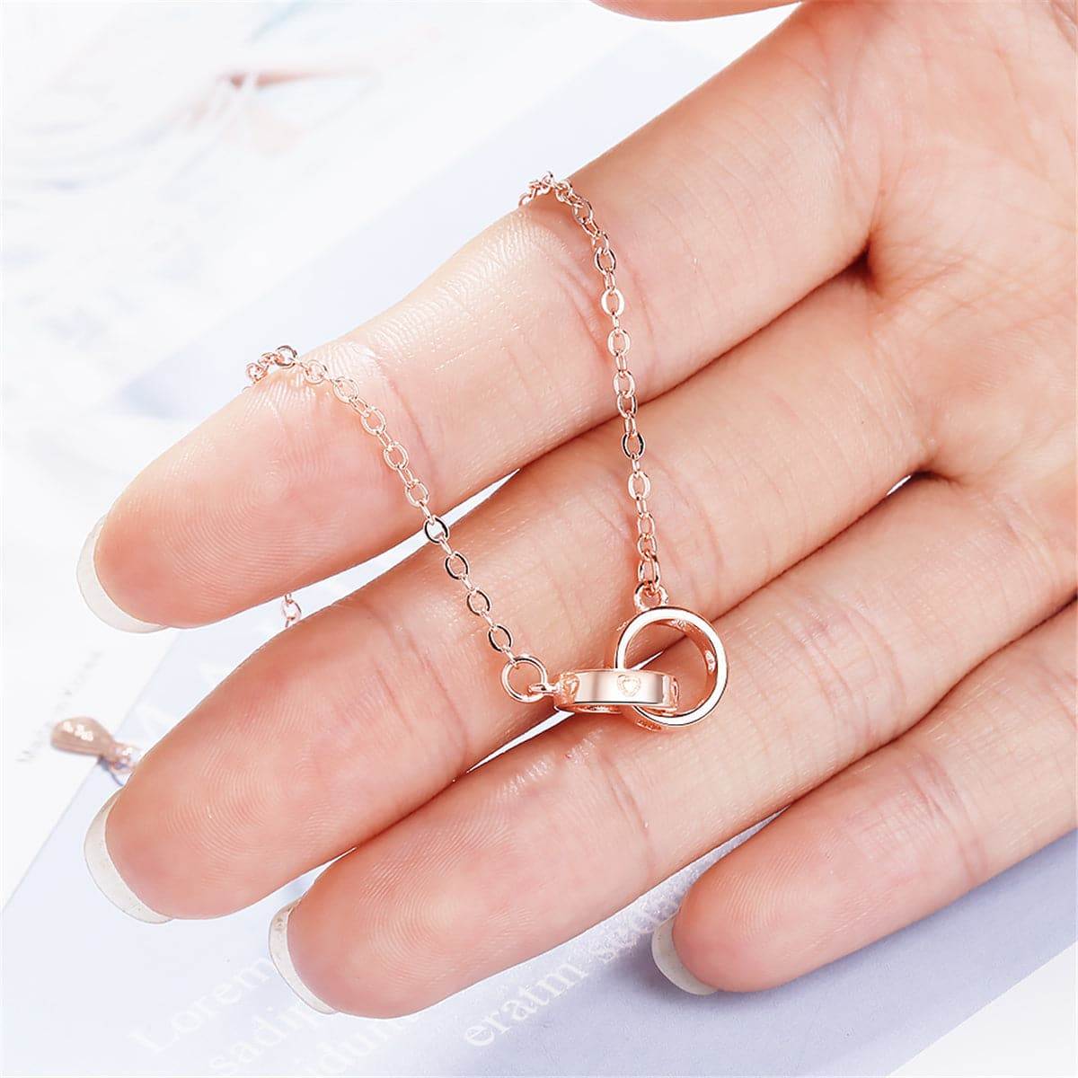 Rose Goldtone Double-Crossing Ring Charm Bracelet