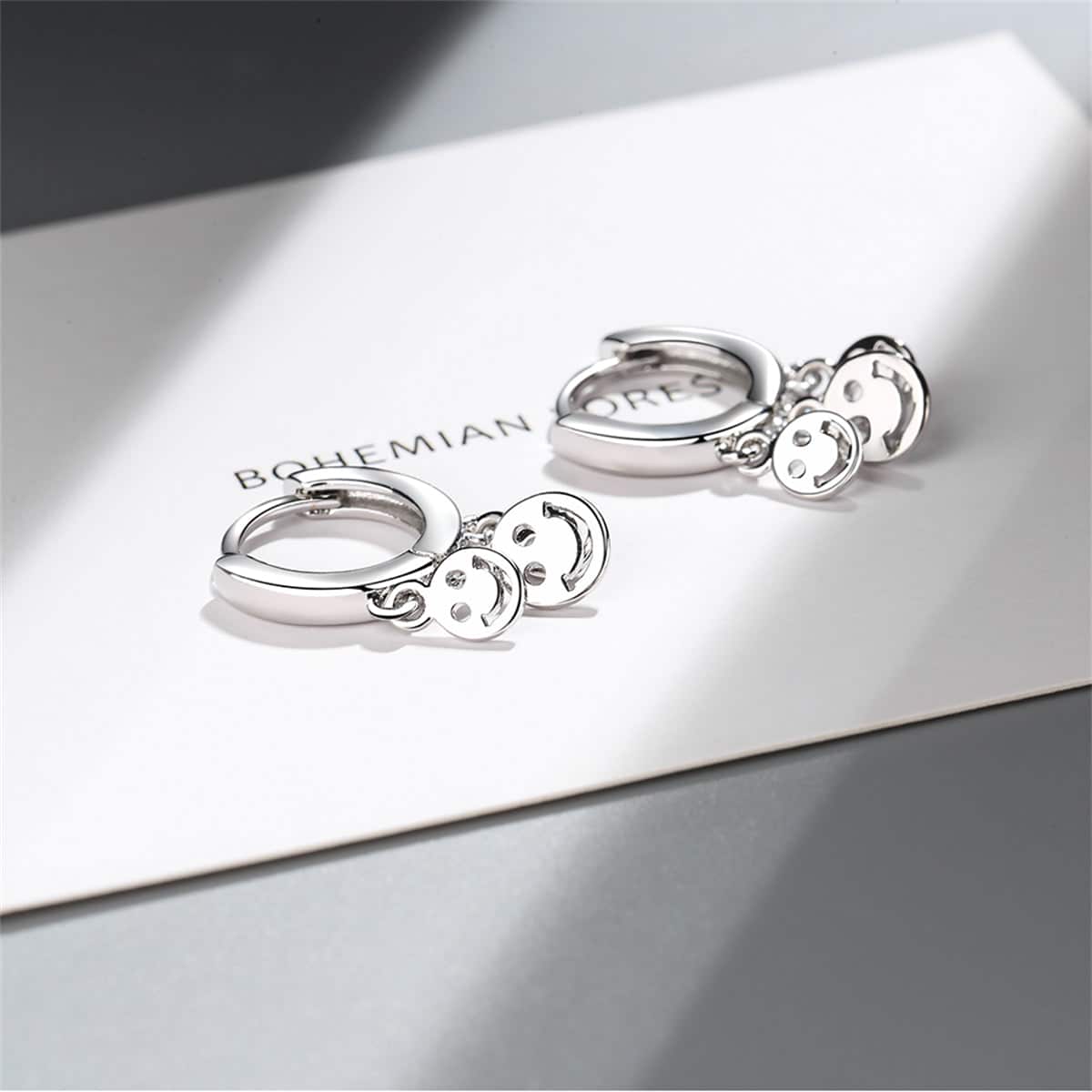 Silvertone Smiley Tassel Huggie Earrings