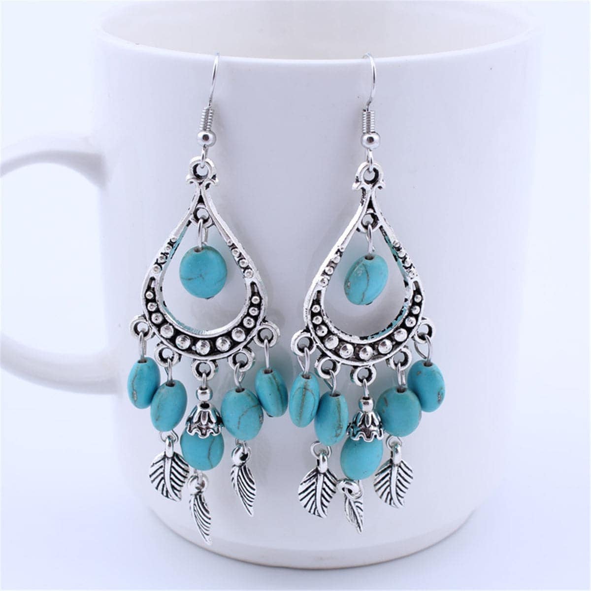 Turquoise & Silvertone Feather Teardrop Earrings