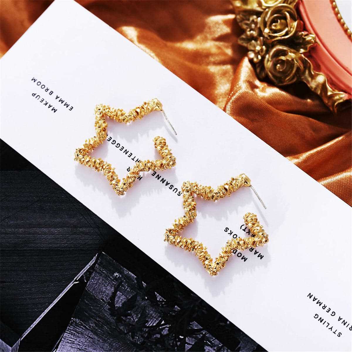 Goldtone Twisted Star Hoop Earring