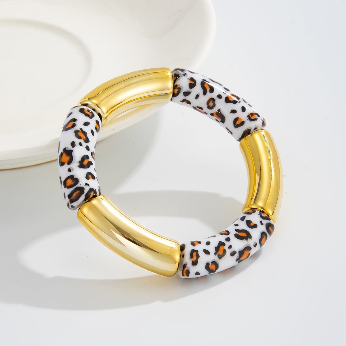 White Resin & Goldtone Cow Print Joint Stretch Bracelet
