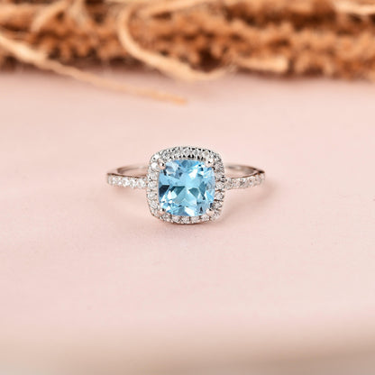1.75 Ct Cushion Natural Blue Topaz Prong Rhodium Over Silver Halo Ring