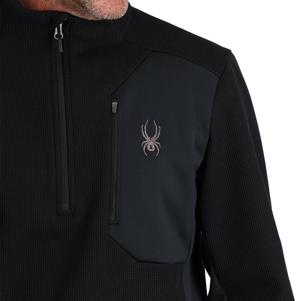 Black Quarter zip with white background.