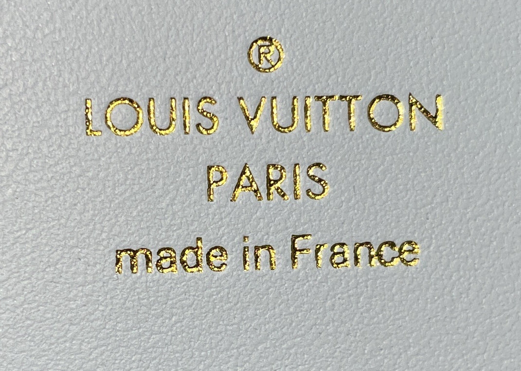 Capucines Vertical Wallet Leather Compact