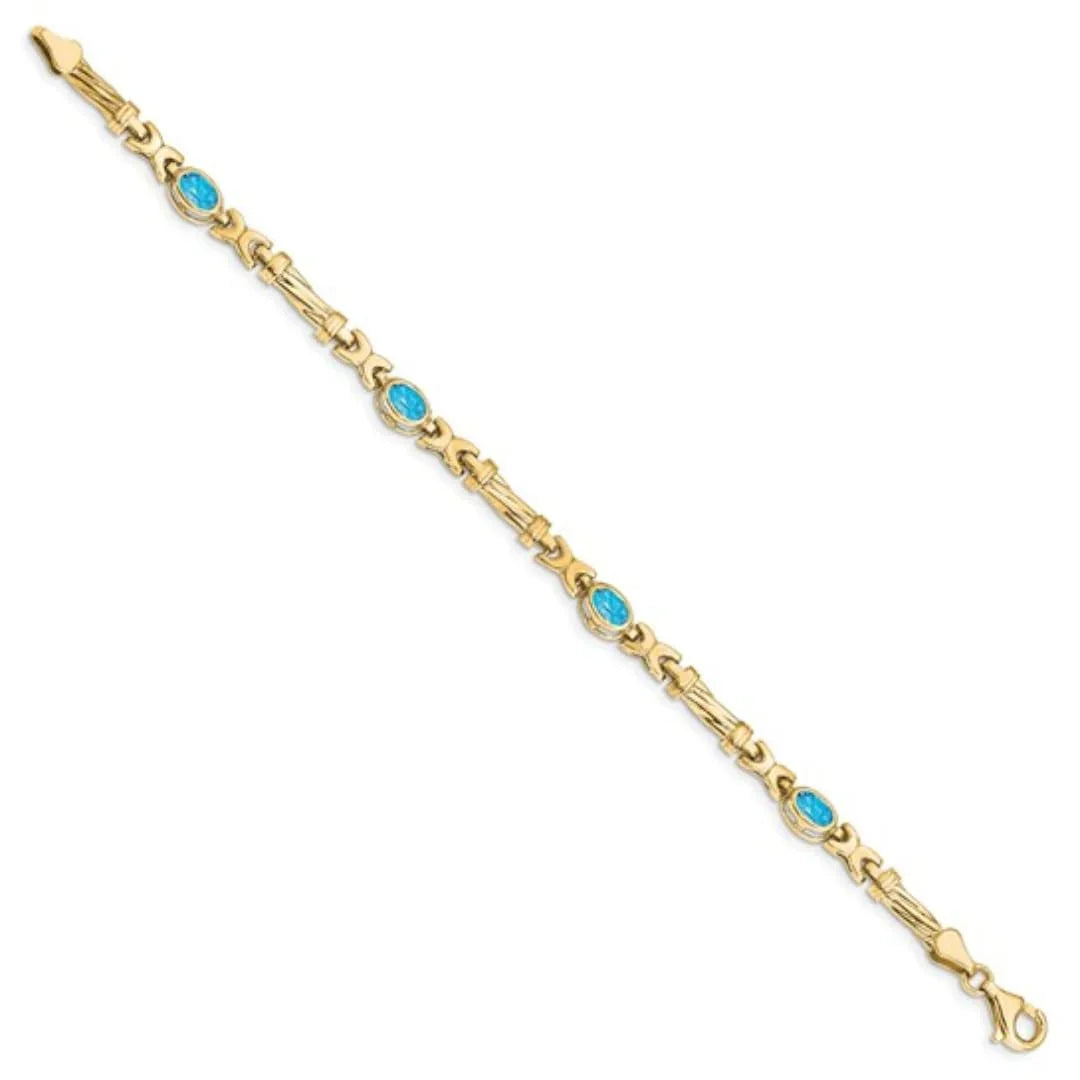 Oval Swiss Blue Topaz Bezel 10K Yellow Gold Fancy Link Bracelet