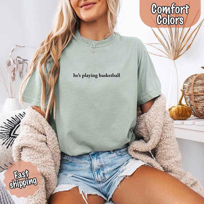 He’s Playing Basketball – Funny Sports Girlfriend Comfort Color Shirt for Women