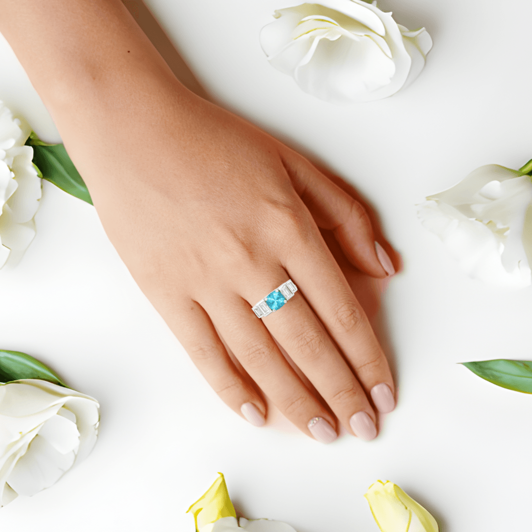 1.05 Ct Cushion Blue Natural Paraiba Apatite Prong Rhodium Plated Sterling Silver Baguette Accents Five Stone Ring