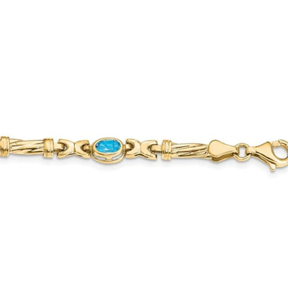 Oval Swiss Blue Topaz Bezel 10K Yellow Gold Fancy Link Bracelet