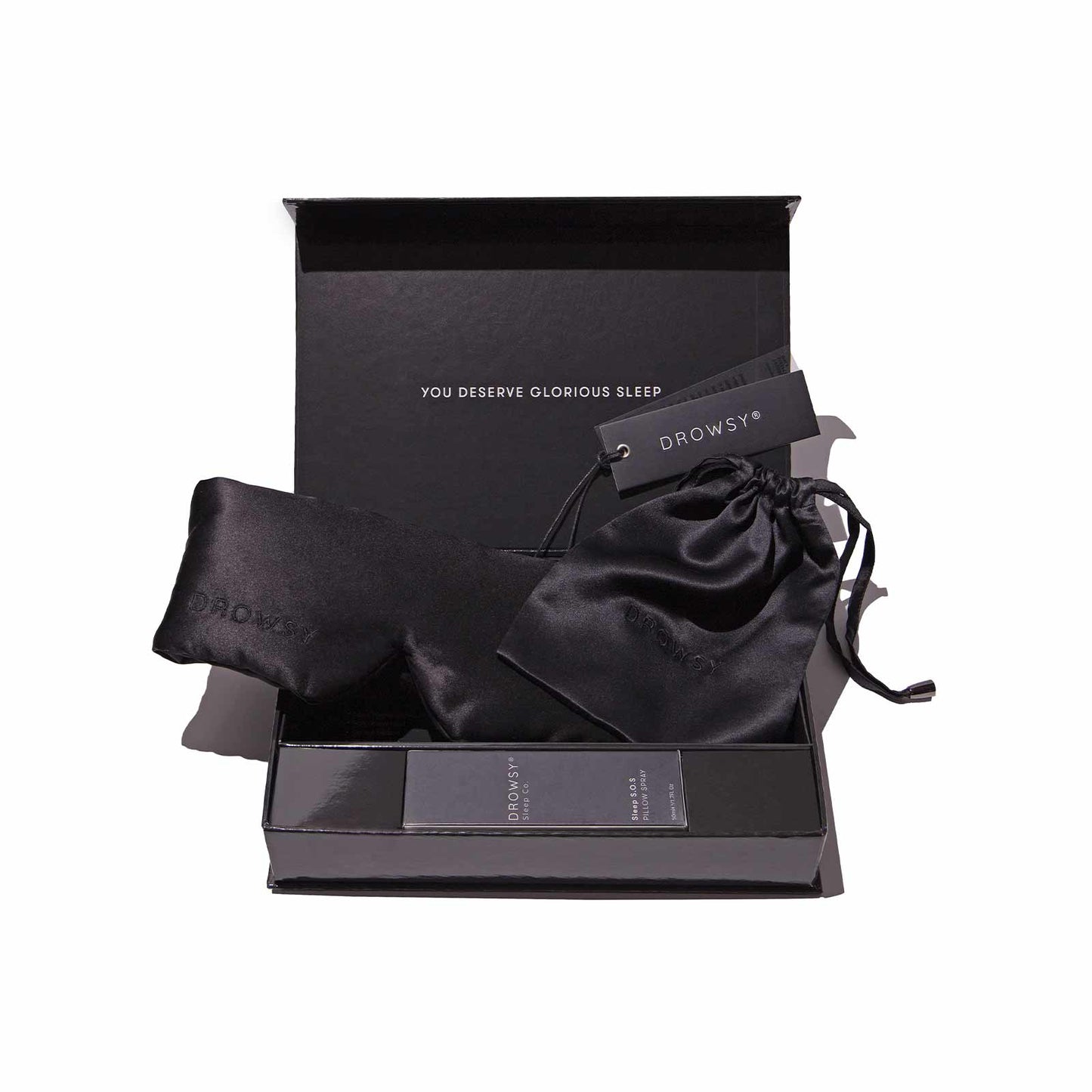 Drowsy Sleep Co Black Gift Box open with mask and pillow spray displayed inside on white background