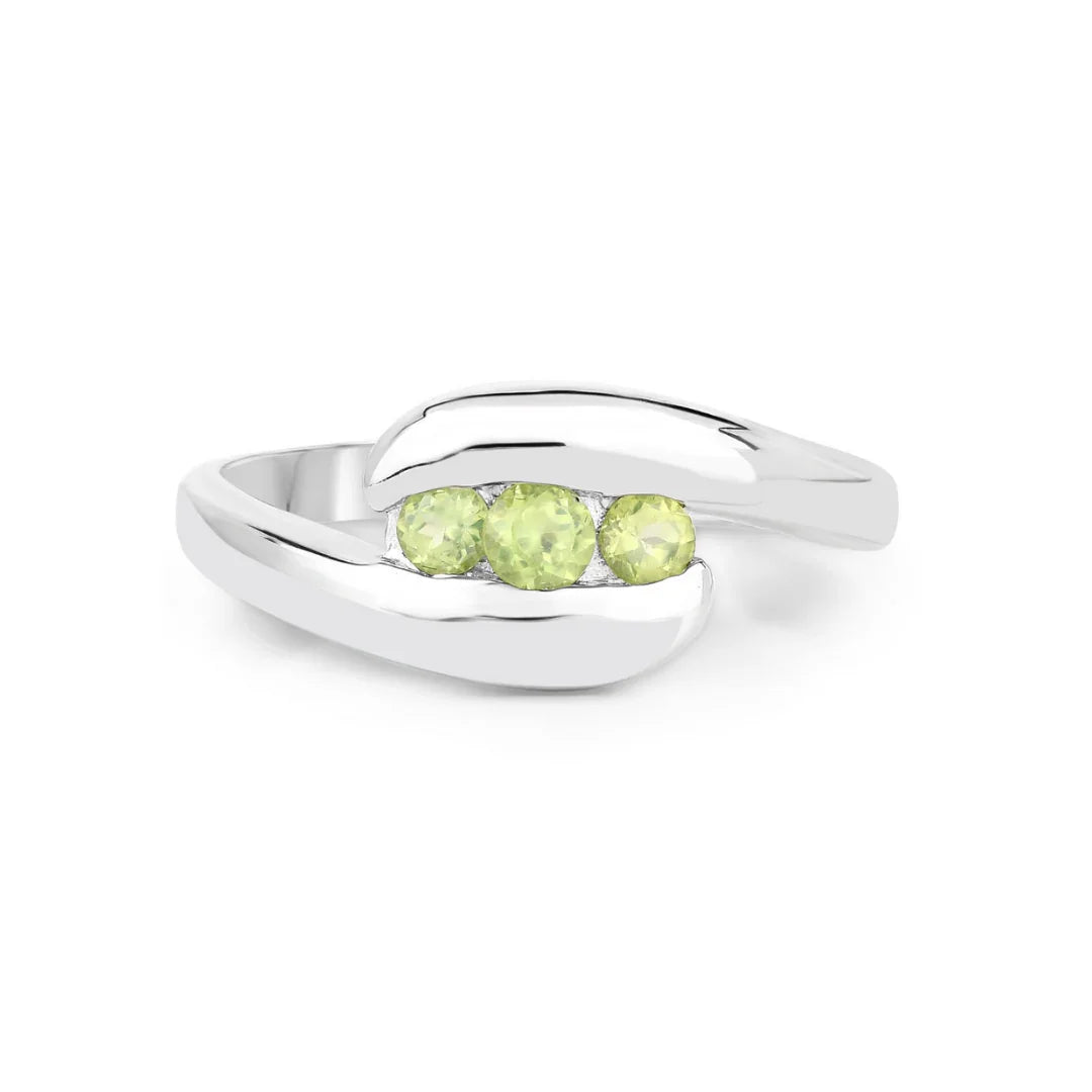 0.56 Ct Oval Green Peridot Channel Silver Three Stone Bypass Ring