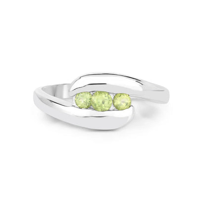 0.56 Ct Oval Green Peridot Channel Silver Three Stone Bypass Ring