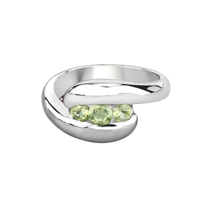 0.56 Ct Oval Green Peridot Channel Silver Three Stone Bypass Ring