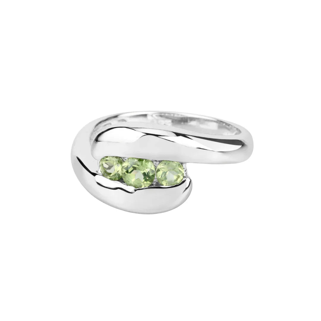 0.56 Ct Oval Green Peridot Channel Silver Three Stone Bypass Ring