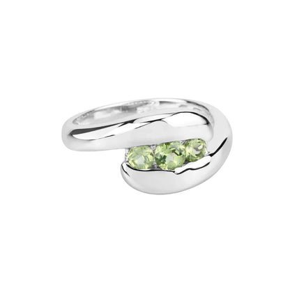 0.56 Ct Oval Green Peridot Channel Silver Three Stone Bypass Ring