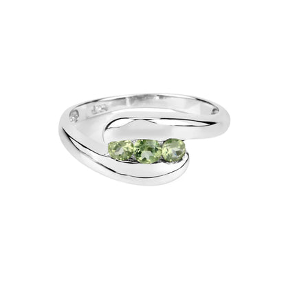 0.56 Ct Oval Green Peridot Channel Silver Three Stone Bypass Ring