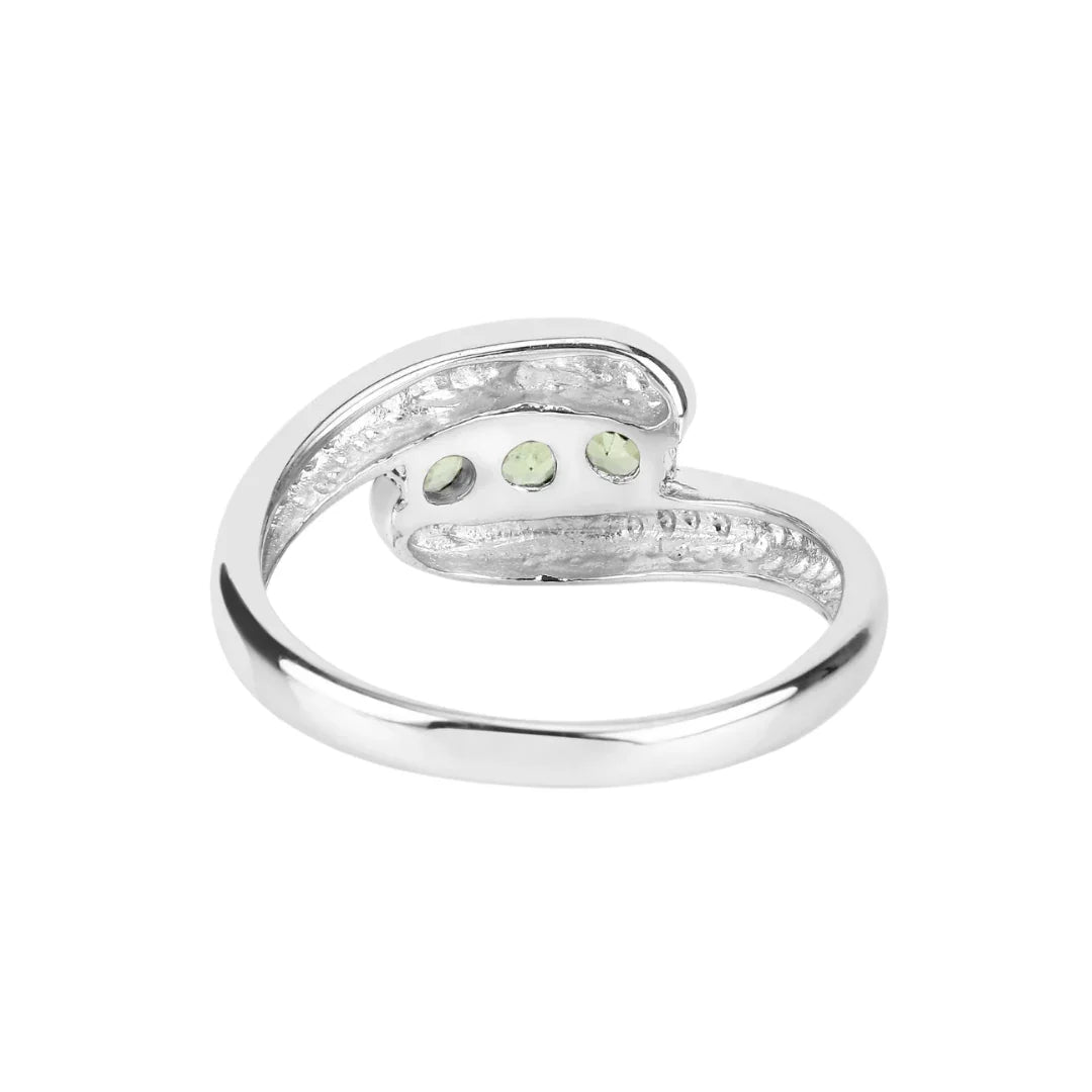 0.56 Ct Oval Green Peridot Channel Silver Three Stone Bypass Ring