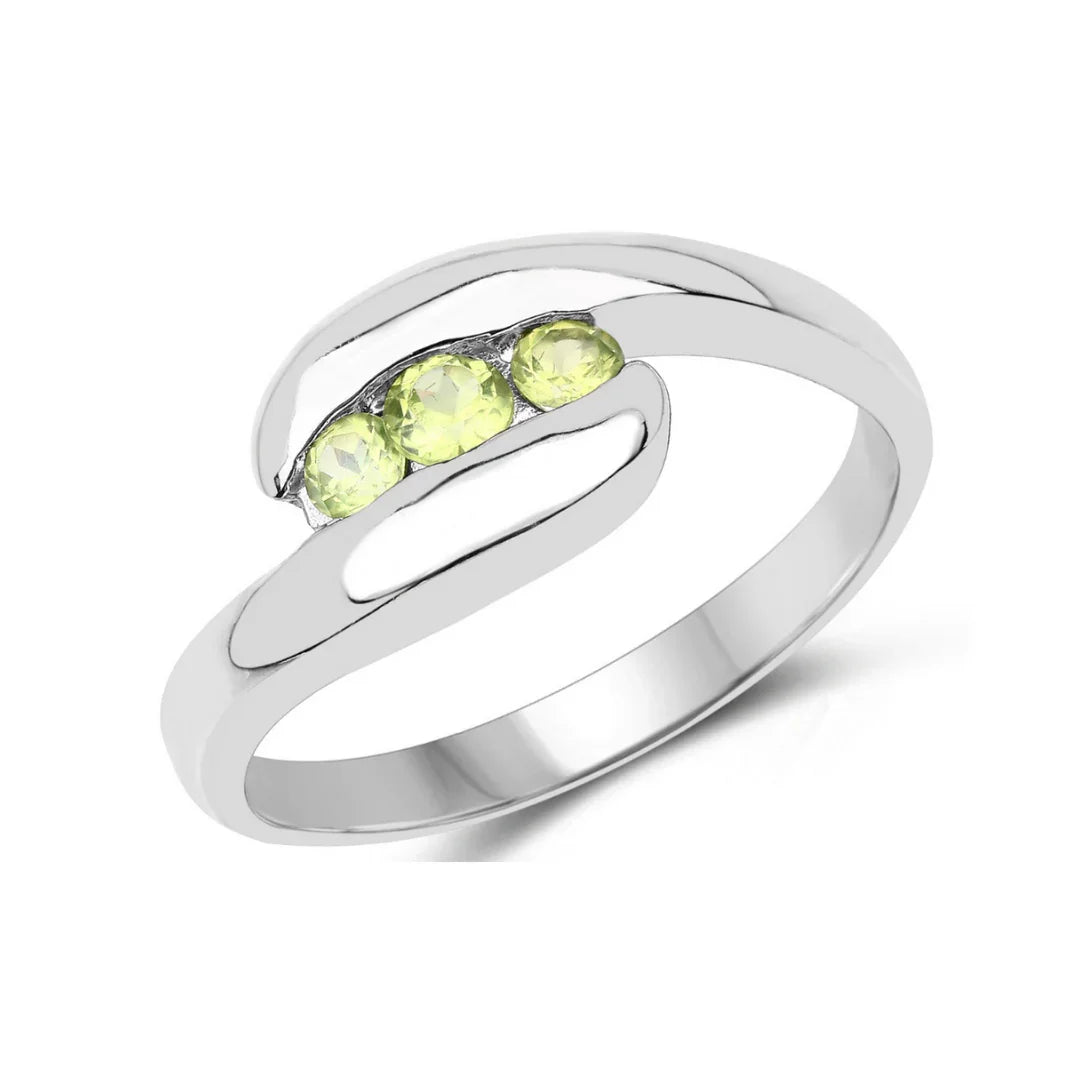 0.56 Ct Oval Green Peridot Channel Silver Three Stone Bypass Ring