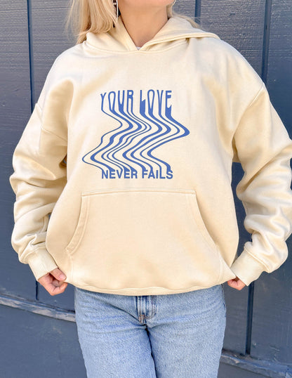 Elevated Faith Love Never Fails Cream Unisex Hoodie