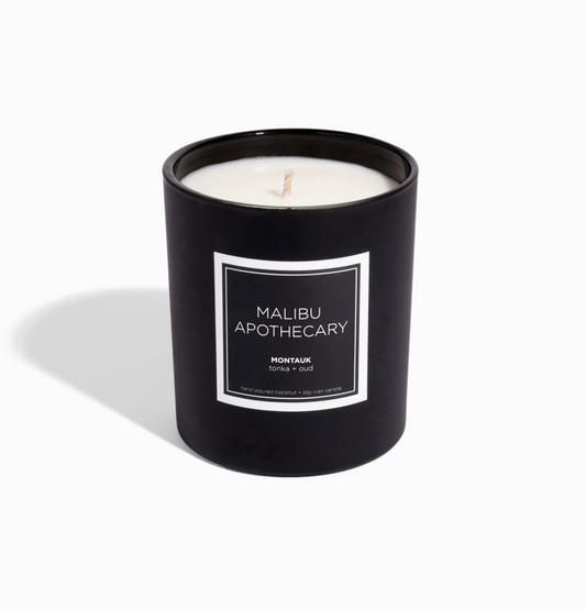 Black clean nontoxic candle with 'Malibu Apothecary' label on a white background
