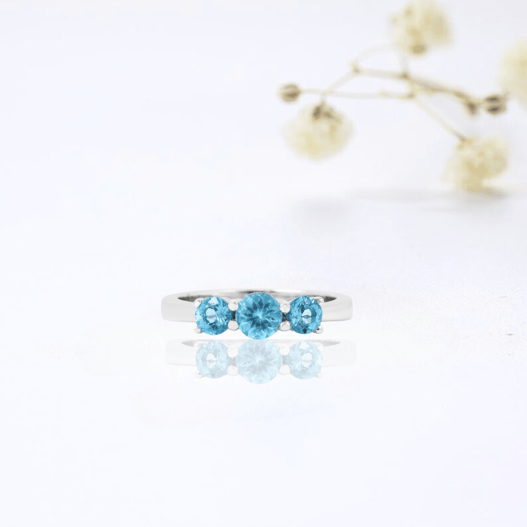 0.55 Ct Round Natural Blue Paraiba Apatite Prong Rhodium Silver Three Stone Ring