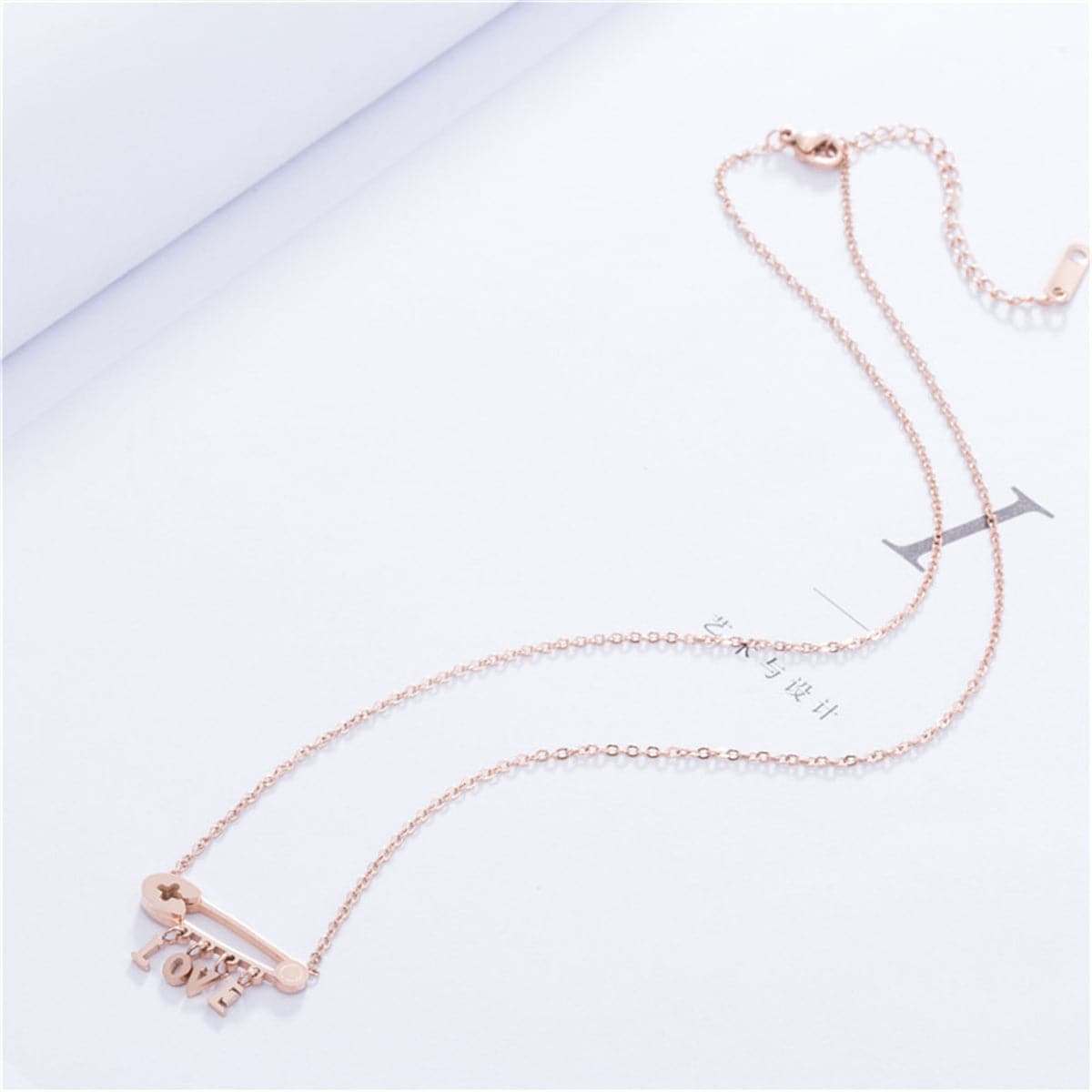 Rose Goldtone 'Love' Safety Pin Pendant Necklace