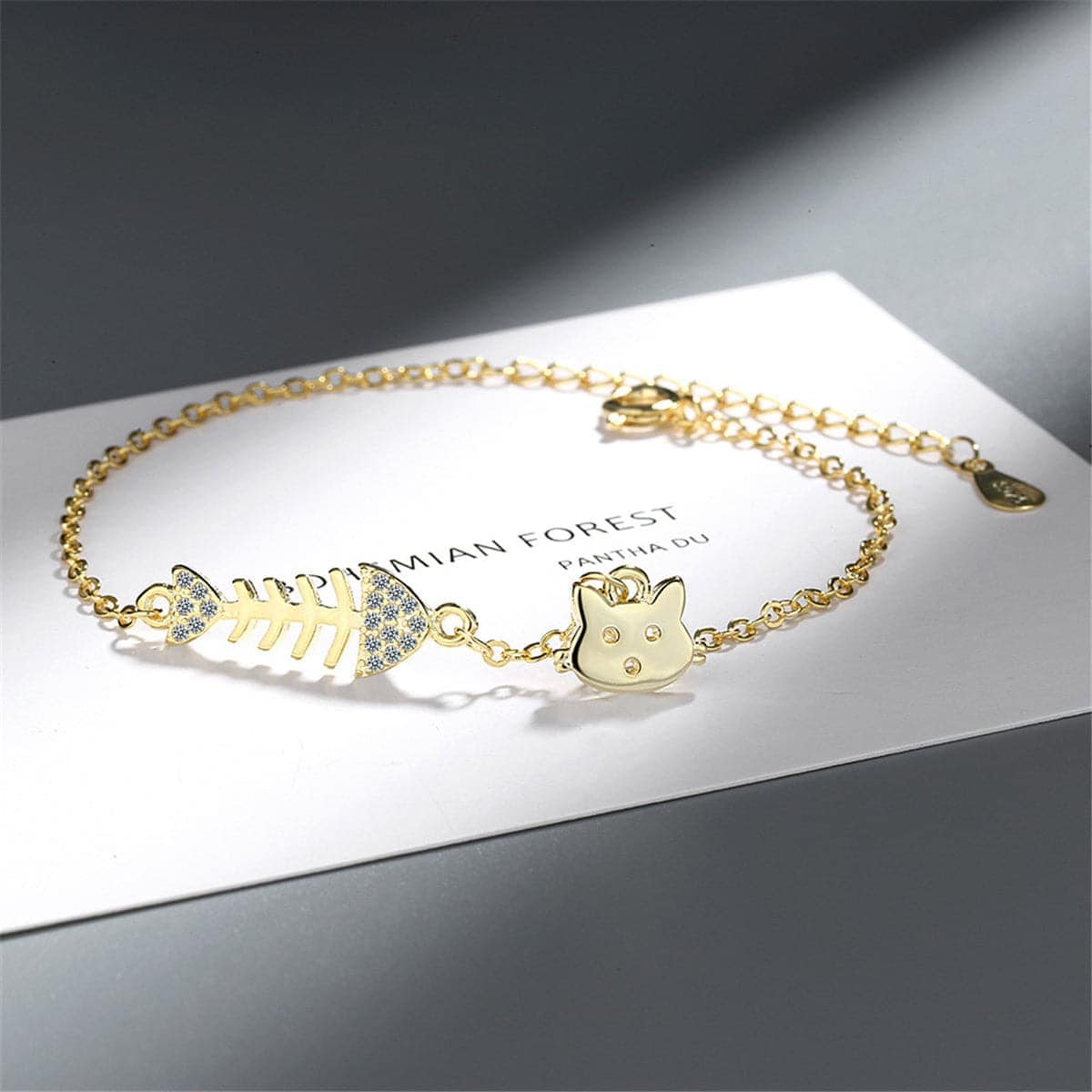 Cubic Zirconia & Goldtone Fishbone & Cat Charm Bracelet