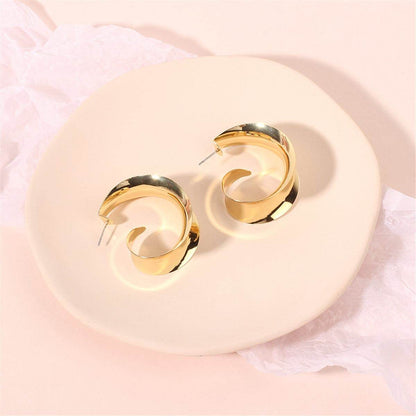 Goldtone Leaf Curl Huggie Earrings