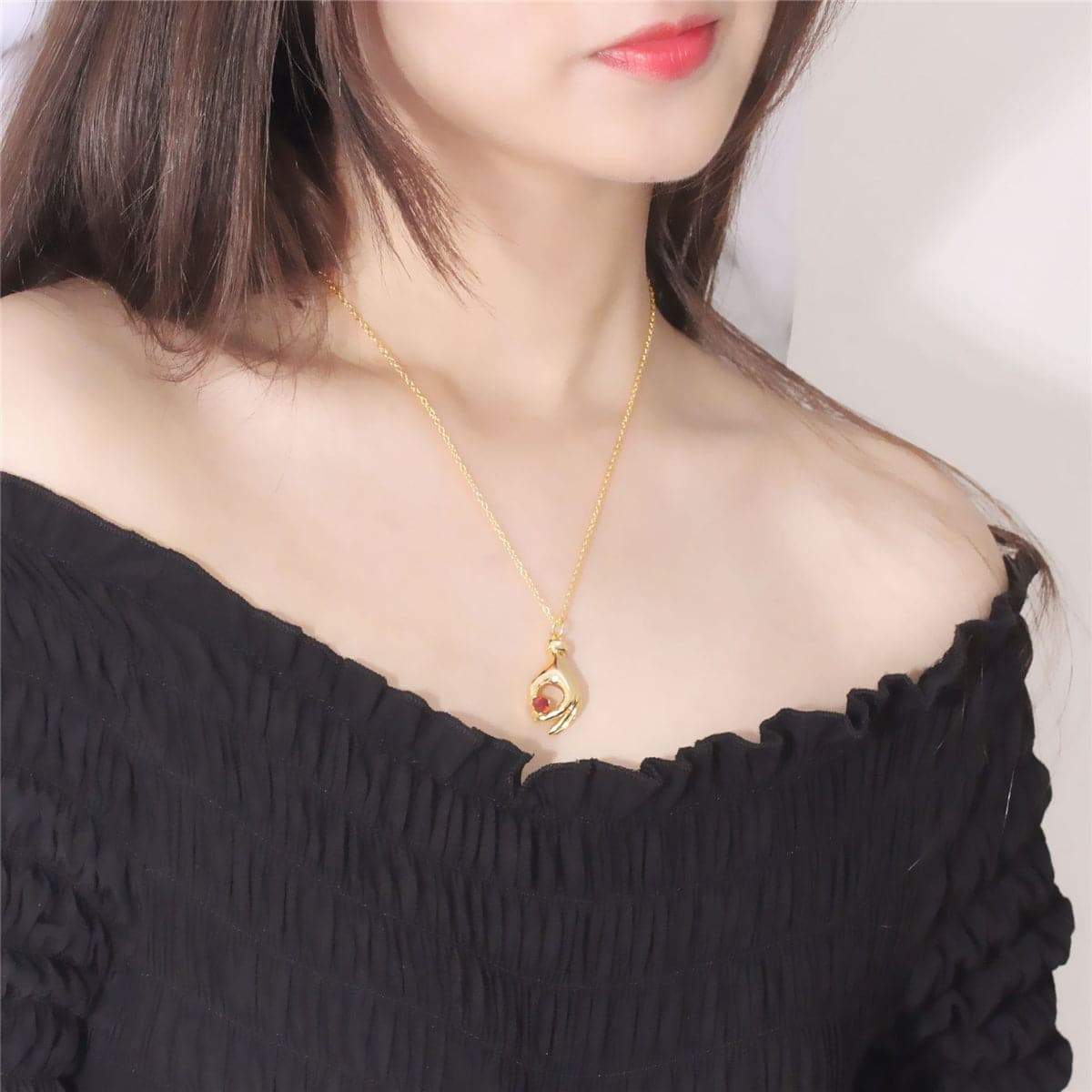 Red Crystal & Goldtone Heart Palm Pendant Necklace