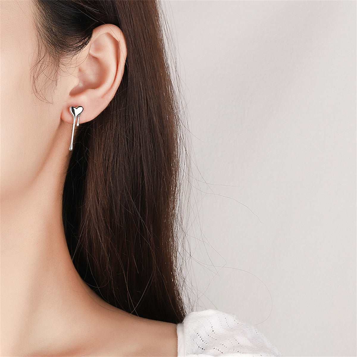 Silvertone Melting Heart Stud Earring
