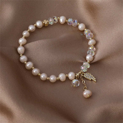 Pearl & Cubic Zirconia Goldtone Wing Charm Stretch Bracelet