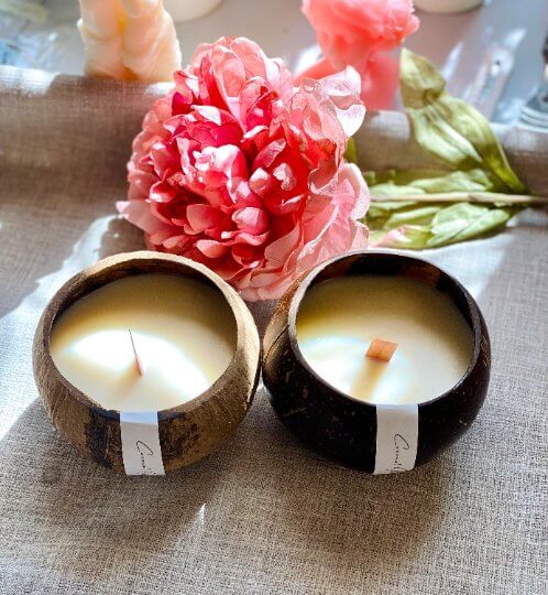 Coconut wax candle in natural coconut shell