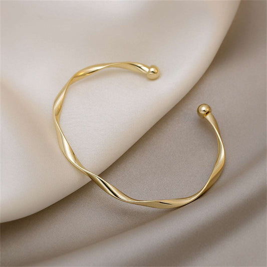 Goldtone Curved Waves Cuff