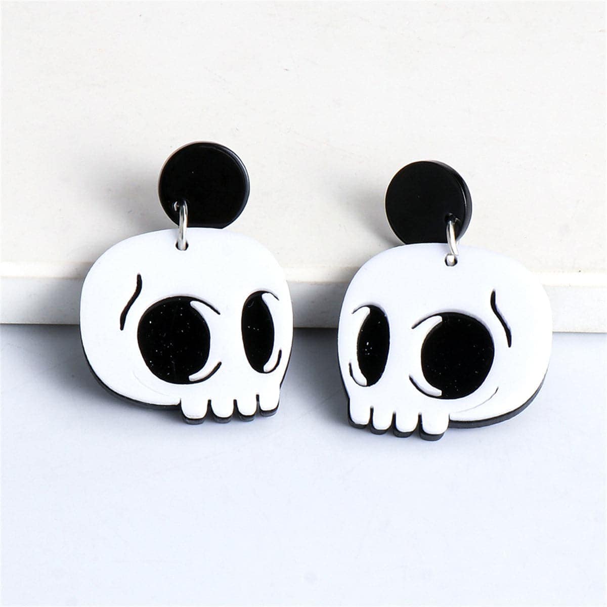 White Acrylic & Silvertone Skull Drop Earrings