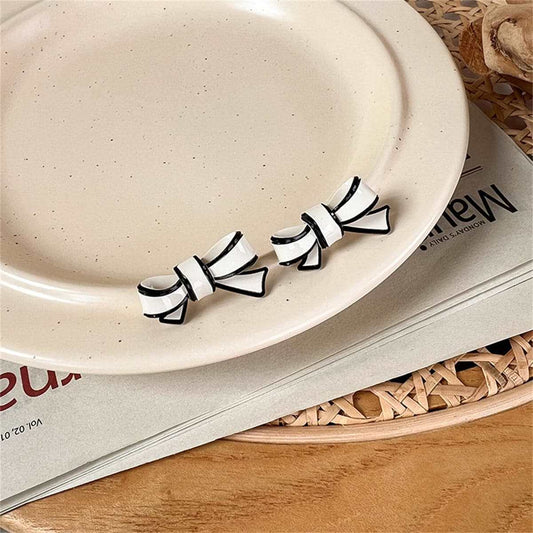 White Polyurethane & Silvertone Bow Stud Earrings