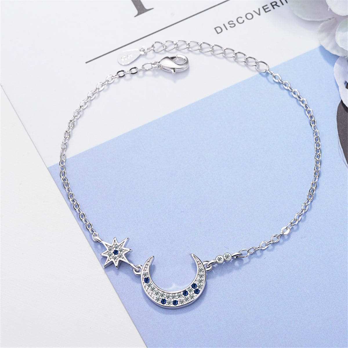 Blue Crystal & Silvertone Star & Crescent Moon Bracelet