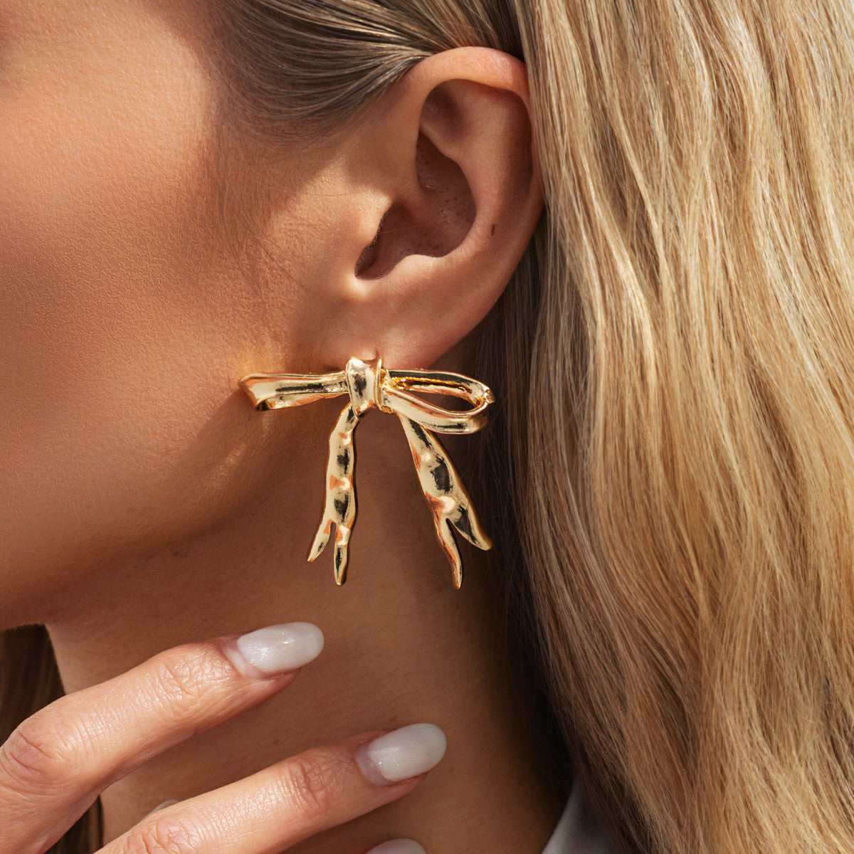 Goldtone Hammered Bow Stud Earrings