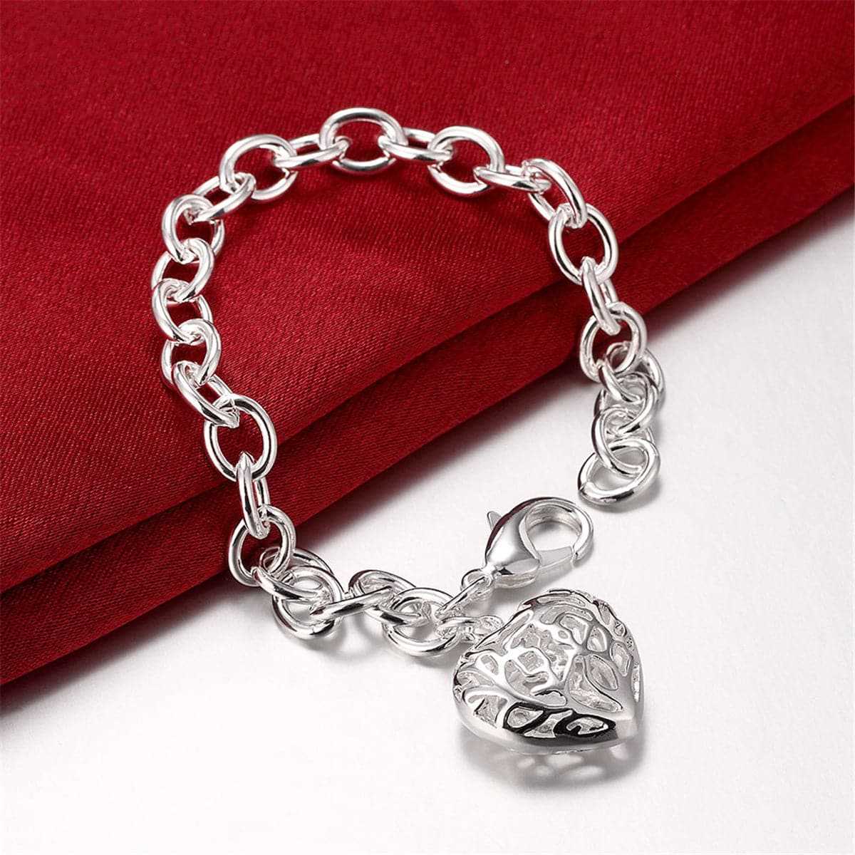 Silvertone Cutout Heart Charm Bracelet