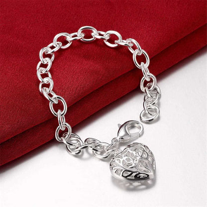 Silvertone Cutout Heart Charm Bracelet
