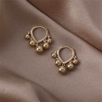 Goldtone Ball Tassel Teardrop Huggie Earrings