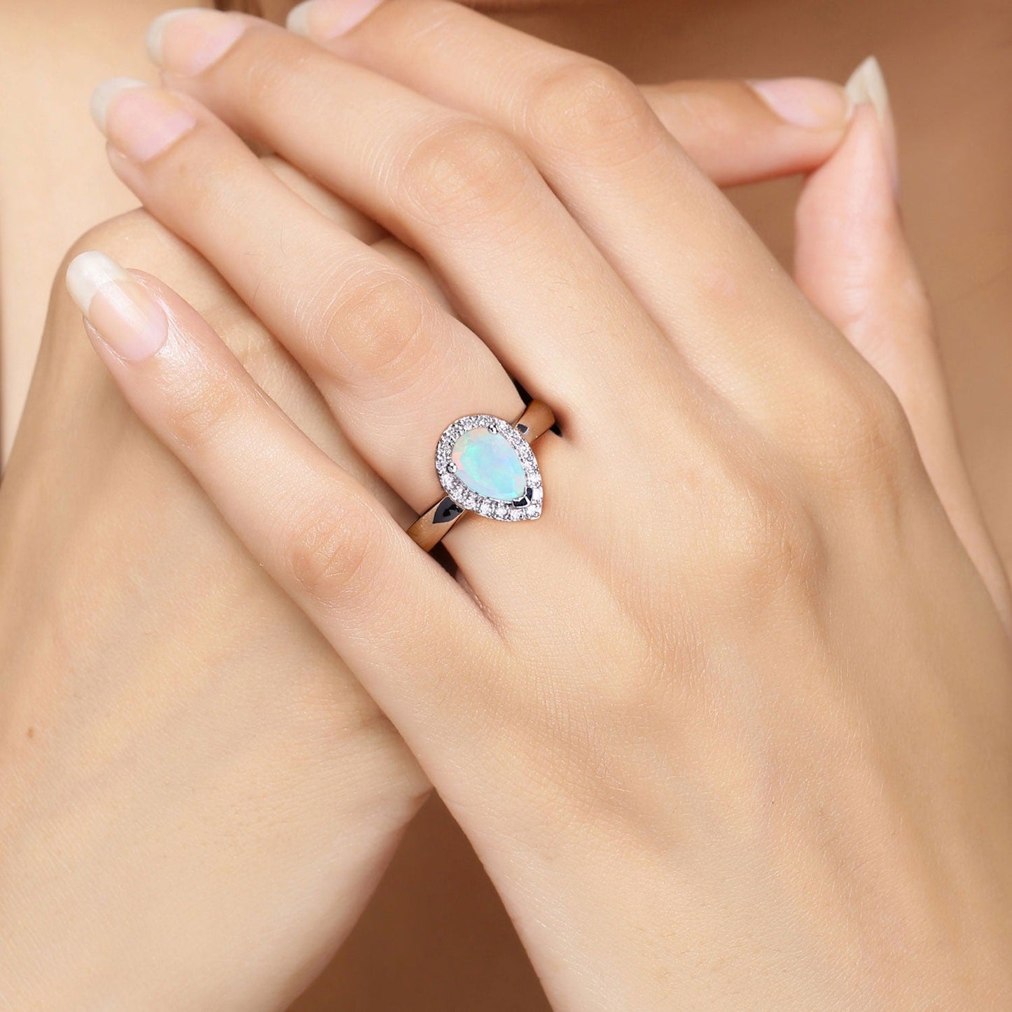 0.90 Ct Teardrop White Ethiopian Opal and Lab Diamond Prong Silver Halo Ring