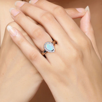 0.90 Ct Teardrop White Ethiopian Opal and Lab Diamond Prong Silver Halo Ring