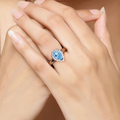 1.30 Ct Oval Swiss Blue Topaz & Lab Diamond Prong Silver Halo Engagement Ring