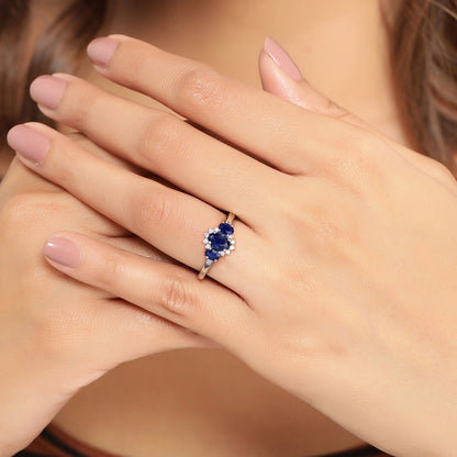0.99 Ct Oval Blue Sapphire and Lab Diamond Prong Silver Three Stone Cocktail Ring