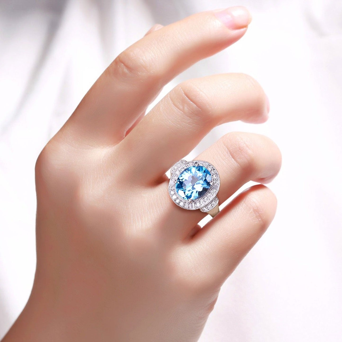 4 Ct Oval Swiss Blue Topaz and Lab Diamond Silver Halo Statement Ring