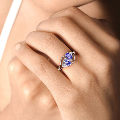 0.88 Ct Oval Violet Tanzanite and Lab Grown Diamond Prong Silver Bypass Ring
