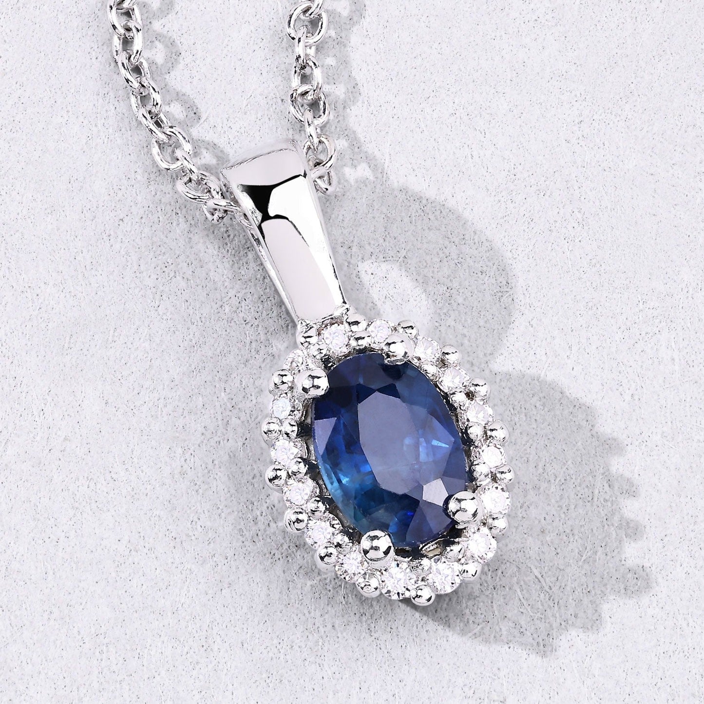 0.55 Ct oval Blue Sapphire and Lab Diamond prong Silver Halo pendant Necklace