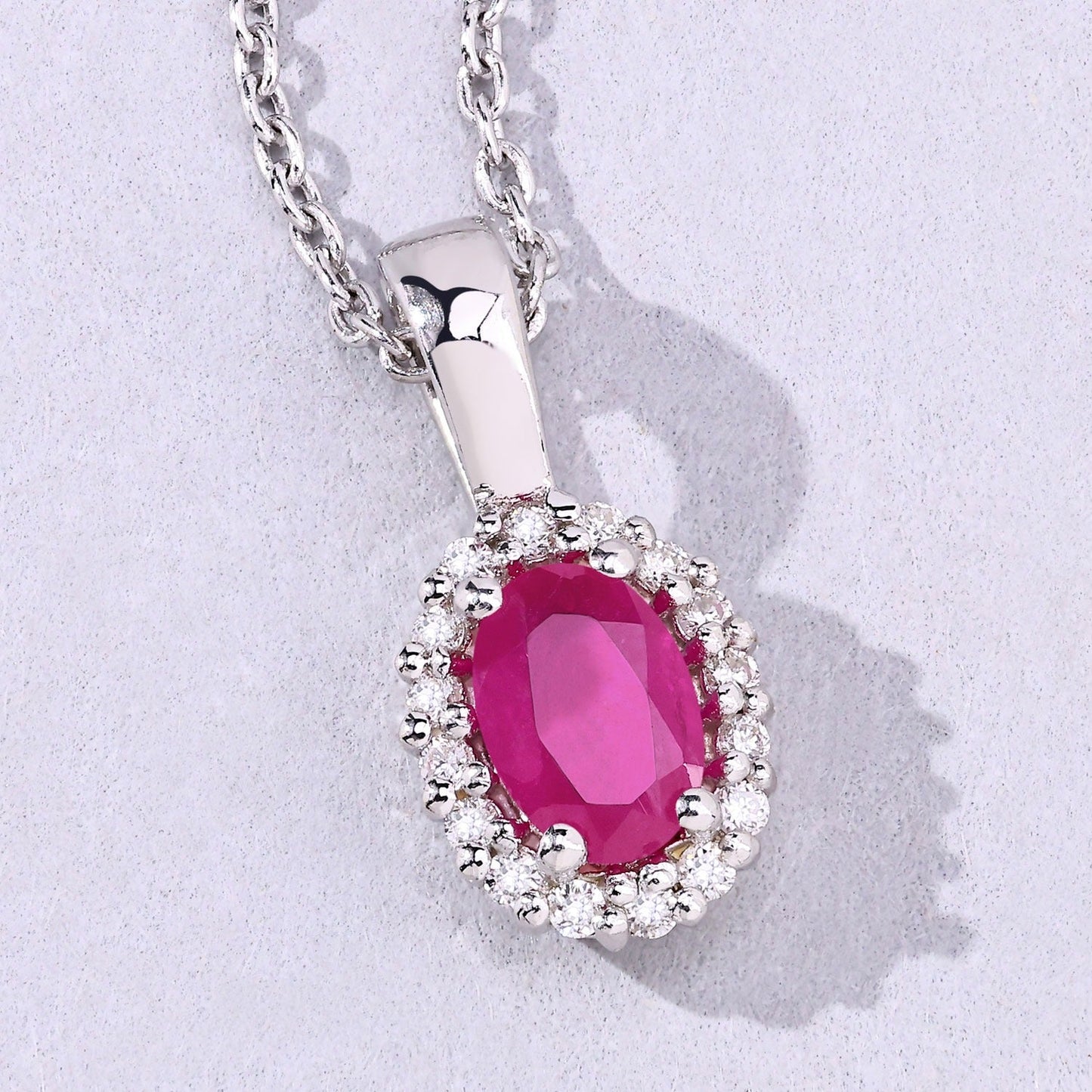 0.52 Ct oval pink Mozambique Ruby and Lab Diamond prong Silver Halo pendant Necklace