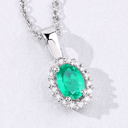 0.44 Ct oval green Zambian Emerald and Lab Diamond prong Silver Halo pendant Necklace